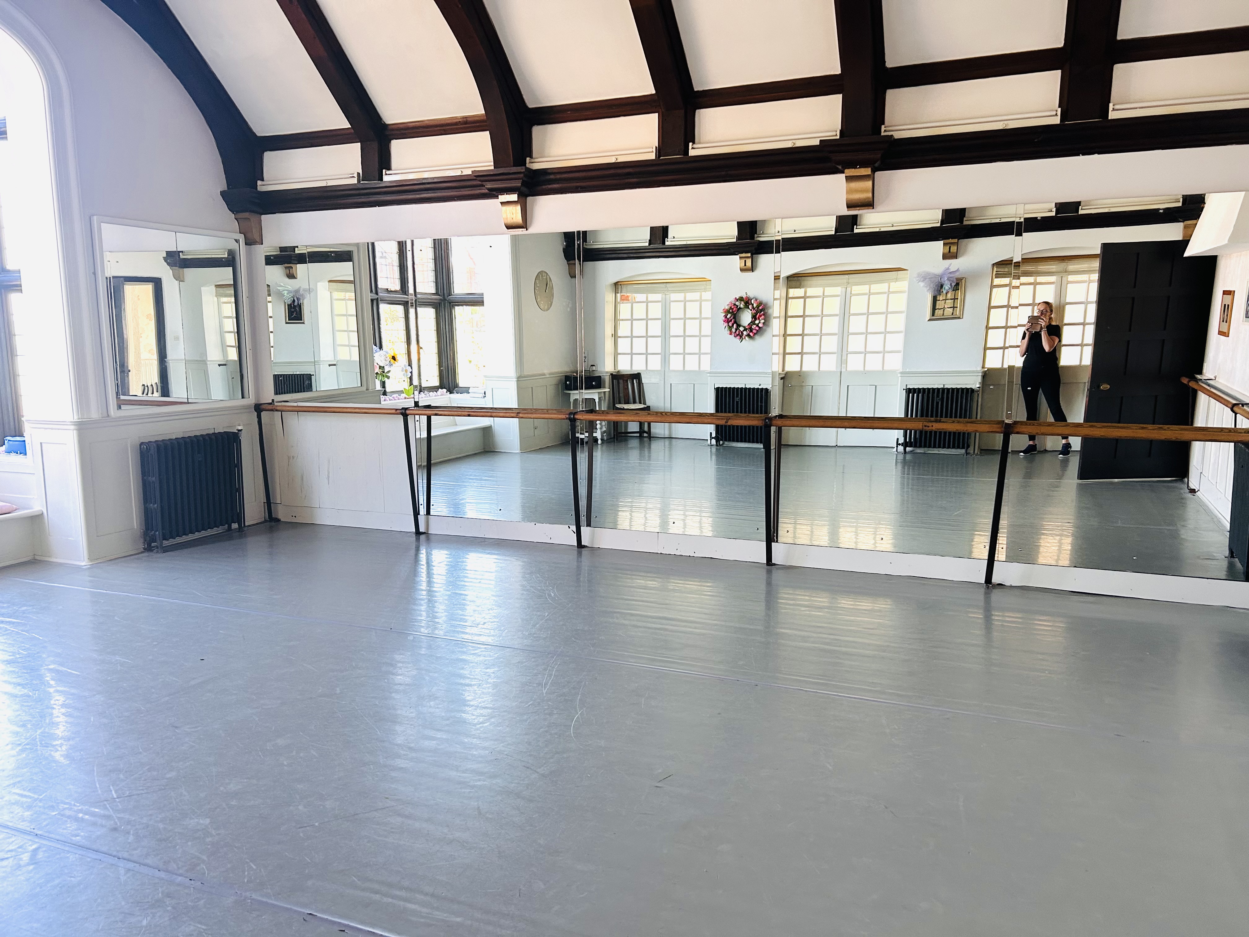 Lovely Dance Studio with Mirrors and Ballet Barres