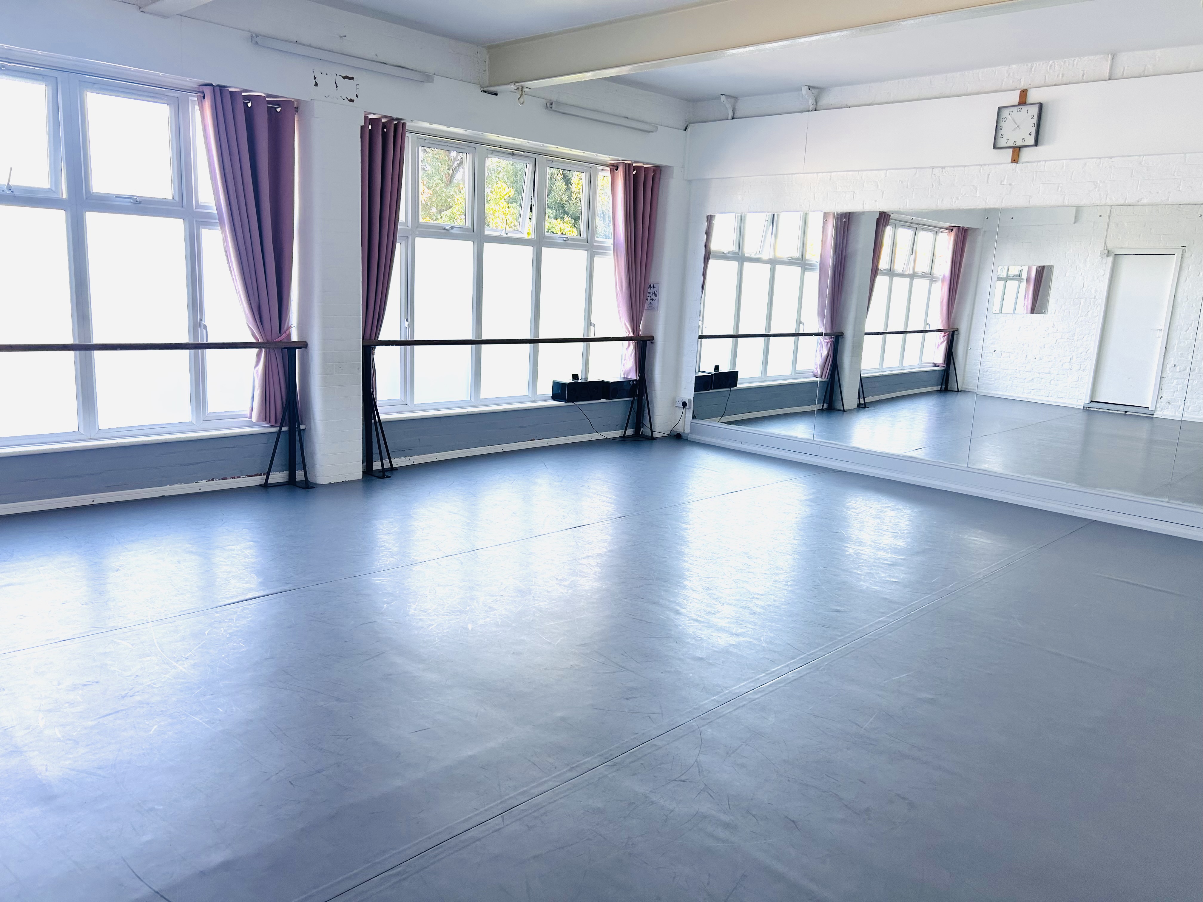 Lovely Dance Studio with Mirrors and Ballet Barres